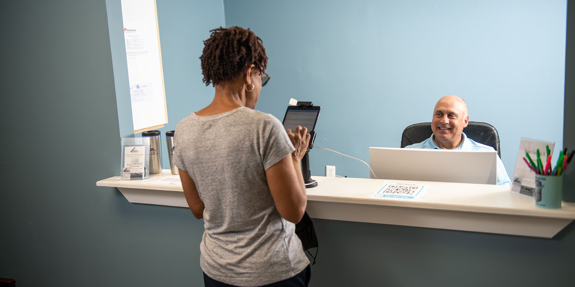 Chiropractor Baltimore MD Mark Stutman at Front Desk