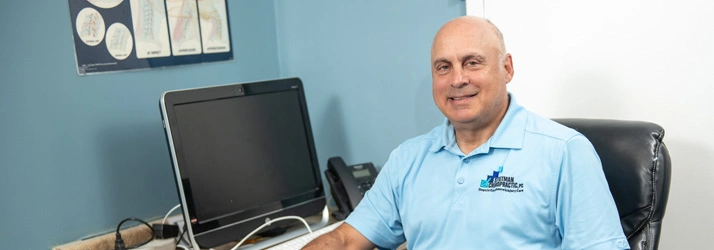 Chiropractor Laurel MD Mark Stutman At Desk