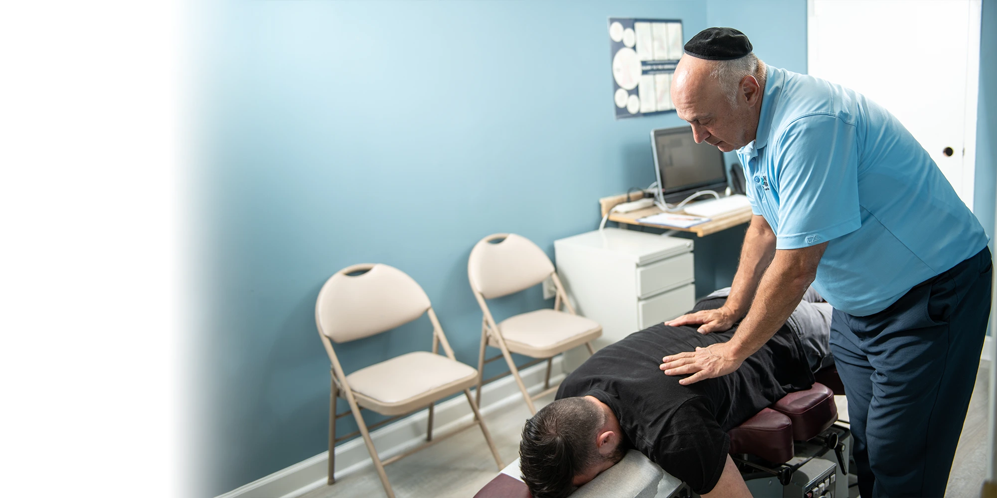 Chiropractor Takoma Park MD Mark Stutman Adjusting Patient