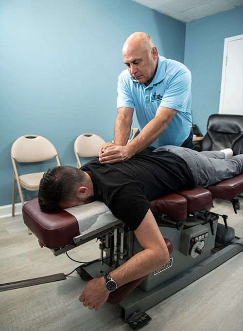 Chiropractor Takoma Park MD Mark Stutman Assessing Patients Back Chiropractor Takoma Park MD Mark Stutman Assessing Patients Back